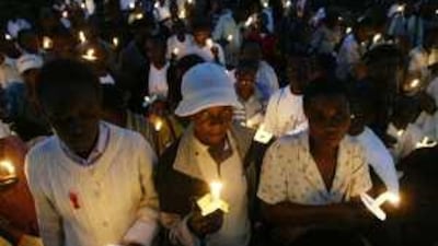 People attend a service in Harare in 2006 in memory of people who have died from Aids. The HIV prevalence rate in Zimbabwe, which is suffering from a severe economic crisis, has fallen to 11 per cent from 23 per cent in 2001.