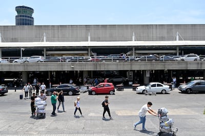 People outside the Rafik Hariri international airport in Beirut. EPA
