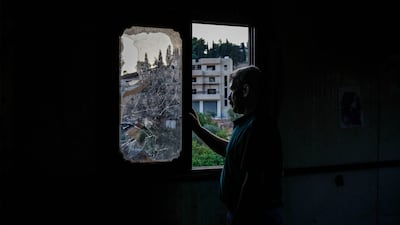 A Palestinian man inspects his home, which was damaged in attacks by Israeli settlers, in Burqah, the occupied West Bank. AFP