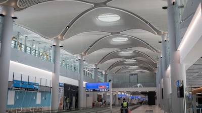 An airport employee works to put finishing touches to the completed hall "B" section. Getty Images