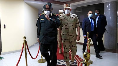 Sudanese military Chief of Staff Mohamed Othman al-Hussein escorts his Egyptian counterpart Mohamed Farid following a meeting of the Egyptian-Sudanese military committee in Sudan's capital Khartoum. AFP