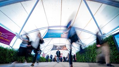 World Travel Market London 2019, ExCeL London - Visitors arrive on day 2, Tuesday, at the west entrance to the sound of a busker playing a trombone