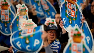 Porto supporters cheer their team before the start of their Uefa Champions League last-16 second-leg match against Roma at the Dragao Stadium in Porto on Wednesday night. Miguel Riopa / AFP