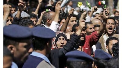 Yemeni activist Tawakul Karman, centre, chants slogans along with other demonstrators during an anti-government protest in Sana'a.