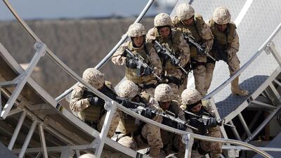 Members of the UAE’s women’s armed forces in a military demonstration to launch the International Defence Exhibition and Conference at the Abu Dhabi National Exhibition Centre last year. Karim Sahib / AFP