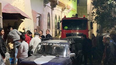 People react at the scene. EPA