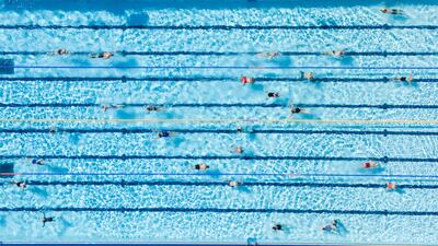 People swim at Banbury Lido, at Woodgreen Leisure Centre in Oxfordshire. PA