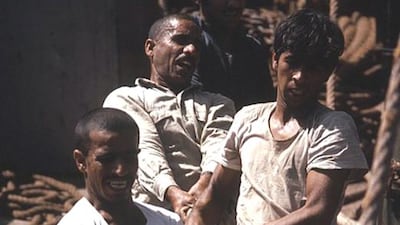 The crew hauling sails.