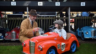 A young racegoer, Indie, attends day two of the Goodwood Revival, which recreates the 1950s and 1960s era of motorsport, at the Goodwood Motor Circuit in Chichester, West Sussex, UK. PA Photo