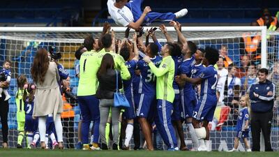 John Terry of Chelsea is thrown into the air after the Premier League match between Chelsea and Leicester City at Stamford Bridge on May 15, 2016 in London, England. (Paul Gilham/Getty Images)