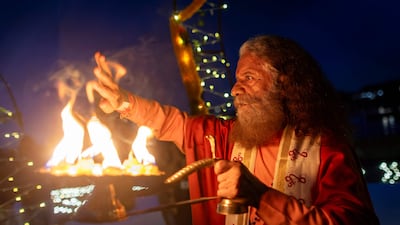 Hindi spiritual leader Chidanand Saraswati conducts a Ceremony of Light: Ganga Aarti on the Thames in Greenwich, south-east London. AFP