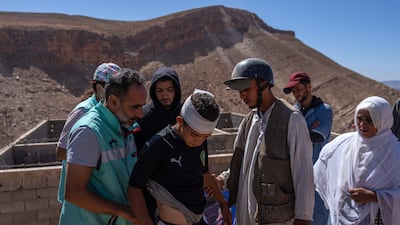 A boy is checked by a paramedic in Allouh, Morocco, after sustaining injuries in Friday's earthquake. Getty Images