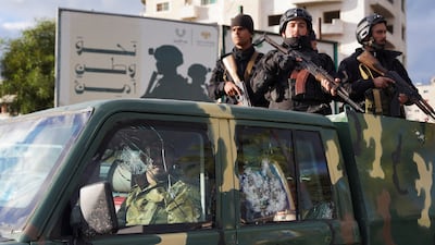 Syrian Security forces stand in the back of a truck during Alawite protests in the coastal city of Latakia. Reuters