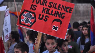 Members of Syria's Armenian minority gather at al-Azizia square in Syria's northern city of Aleppo to protest against the fighting between Armenian and Azerbaijani forces over the Nagorno-Karabakh region. AFP