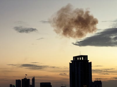 Smoke rises after an Iranian drone was intercepted in Manama on Friday. Reuters
