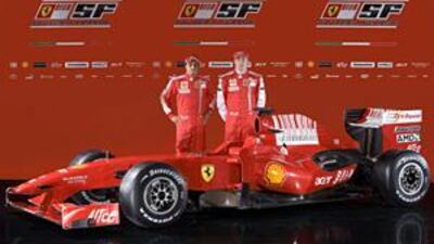 Ferrari drivers Felipe Massa, left, and Kimi Raikkonen pose with the new Ferrari F60.
