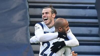 Gareth Bale celebrates with Brazilian midfielder Lucas Moura after scoring against Burnley. AFP