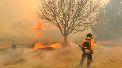 A handout photo made available by the Flower Mound Fire Department shows firefighters with the Flower Mound Fire Department out of Flower Mound, Texas, helping to contain a wildfire in the panhandle region of Texas, USA, 27 February 2024 (issued 28 February 2024). The fire is affecting 500,000 acres of land and is the second largest fire in Texas history. EPA / FLOWER MOUND TEXAS FIRE DEPARTMENT HANDOUT HANDOUT EDITORIAL USE ONLY / NO SALES HANDOUT EDITORIAL USE ONLY / NO SALES