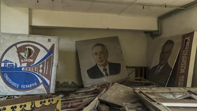 Posters and portraits are seen in a building. Getty Images