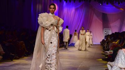 A model presents a creation by Manish Malhotra.