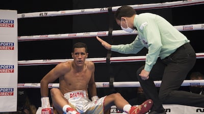 Venezuelan boxer Heber Rendon knock off balance by Trusynbay Kulakhmet of Kazakhstan at the Rotunda, Ceasar's Palace, Bluewaters Island, Dubai. Leslie Pableo for The National
