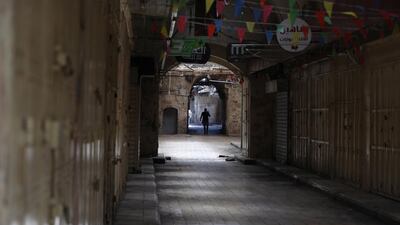 Palestinians walk in the West Bank city of Nablus. EPA