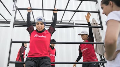 Female government employees warm up before the Dubai Government Games held at Kite Beach, Dubai on May 12, 2018. Reem Mohammed / The National