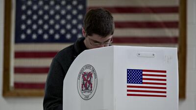A voter casts a ballot at a polling station in Leesburg, Virginia. Bloomberg