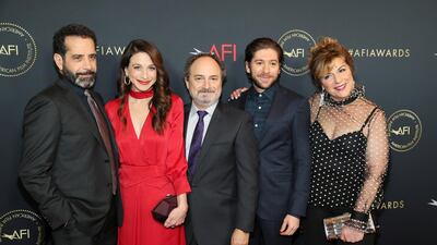 Actors Tony Shalhoub, Marin Hinkle, Kevin Pollak, Michael Zegen and Caroline Aaron - the cast of 'The Marvelous Mrs. Maisel' - all look smart as they line up together on the red carpet. REUTERS