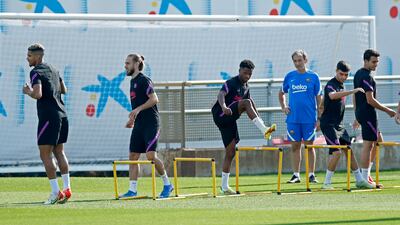 Barcelona's Ronald Araujo, Oscar Mingueza and Ansu Fati. Reuters