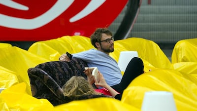People sit on sofas as they watch a 2014 World Cup soccer match during a public viewing event at the Alte Forsterei stadium in Berlin on June 15, 2014. Thomas Peter / Reuters