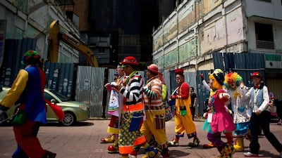 Clowns take part in a parade during the Clown Festival in Kuala Lumpur.