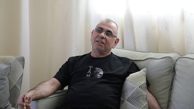 Adeeb Sami wears a black T-shirt emblazoned with the face of a Maori warrior and the words "Ta Moko" (Maori tattoo art) as he recounts the story of the day he was shot.