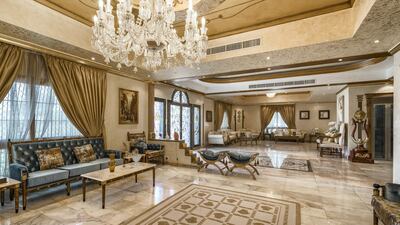 The living room stretches across the entire rear of the house. Courtesy LuxuryProperty.com