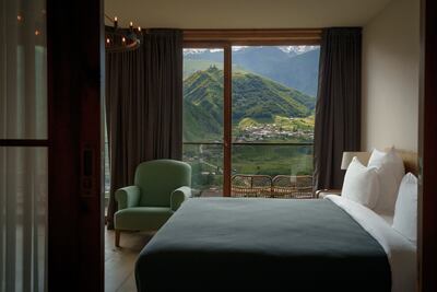 Rooms at this chic mountain lodge oversee the Caucasus. Photo: Hotel Kazbegi