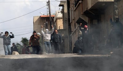 One of the first pictures documenting the Syrian conflict, taken on March 23, 2011, shows anti-government protesters gesturing on the streets of Deraa.cAFP Photo
