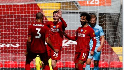 Liverpool's Andrew Robertson, second left, celebrates with teammates after scoring the opening goal against Burnley at Anfield on Saturday. AP
