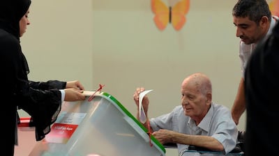 A Bahraini voter casts his ballot at a polling station in the city of Al-Muharraq, north of Manama on November 24, 2018. AFP