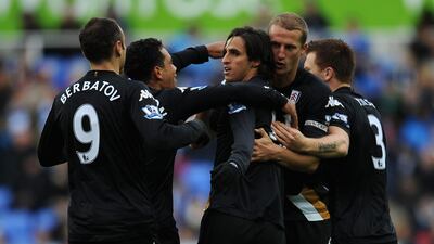 Bryan Ruiz of Fulham is congratulated by his team-mates after scoring against Reading. Christopher Lee/Getty Images