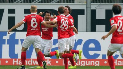 Shinji Okazaki, second left, celebrates with Mainz teammates after scoring in their Bundesliga match against Paderborn on Sunday. AFP Photo / DPA / August 24, 2014
