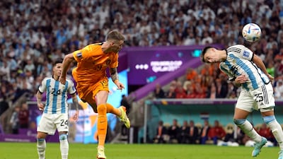 Wout Weghorst heads home his first goal for the Dutch. PA.