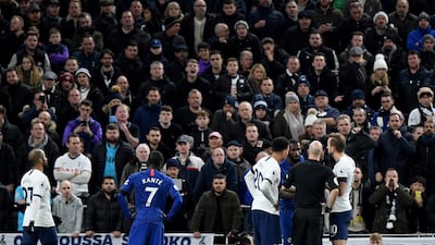 Referee Anthony Taylor speaks to Antonio Rudiger after the Chelsea player was racially abused by Spurs fans. EPA