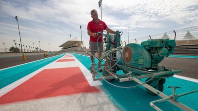 A fresh coat of Yas Blue is laid down across the circuit. Courtesy Yas Marina Circuit