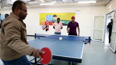 Labourers play ping pong at the Saadiyat Accommodation Village in Abu Dhabi. Christopher Pike / The National