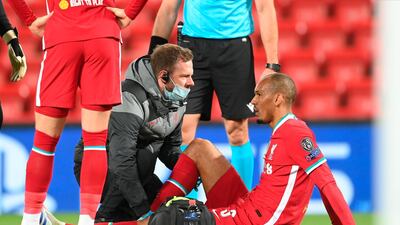 Liverpool's Fabinho receives medical treatment during the Champions League match against Midtjylland at Anfield. EPA