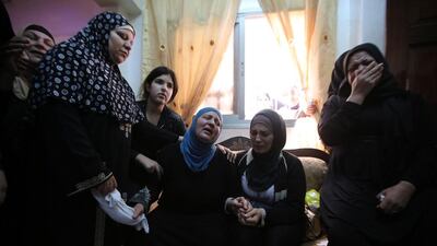 Palestinian relatives mourn for Mohammed Sami Al Ksbeh, a 17- year old Palestinian who was killed by Israeli forces, during his funeral at Qalandiya refugee camp in the West Bank on July 3, 2015. Abbas Momani/AFP Photo