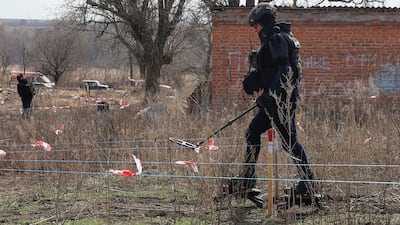 Ukrainian de-mining teams are dealing with what Kyiv says are swathes of land contaminated with Russian explosives. EPA