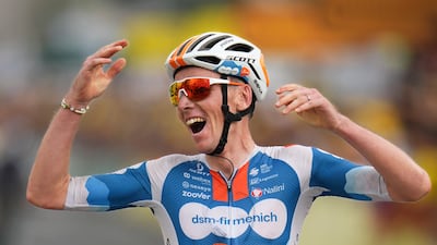 France's Romain Bardet, of Team dsm-firmenich PostNL, crosses the finish line to win Stage 1. AP