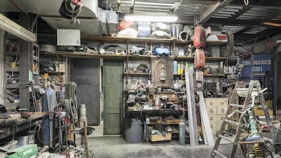 The fully functioning bike workshop at the back is housed in a repurposed shipping container replete with large windows to allow visitors to see the oil-under-the-fingernails toil. Antonie Robertson / The National.