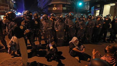 Lebanese students protest a decision by top universities to adopt a new dollar exchange rate to price tuition in Beirut's Hamra district. AFP